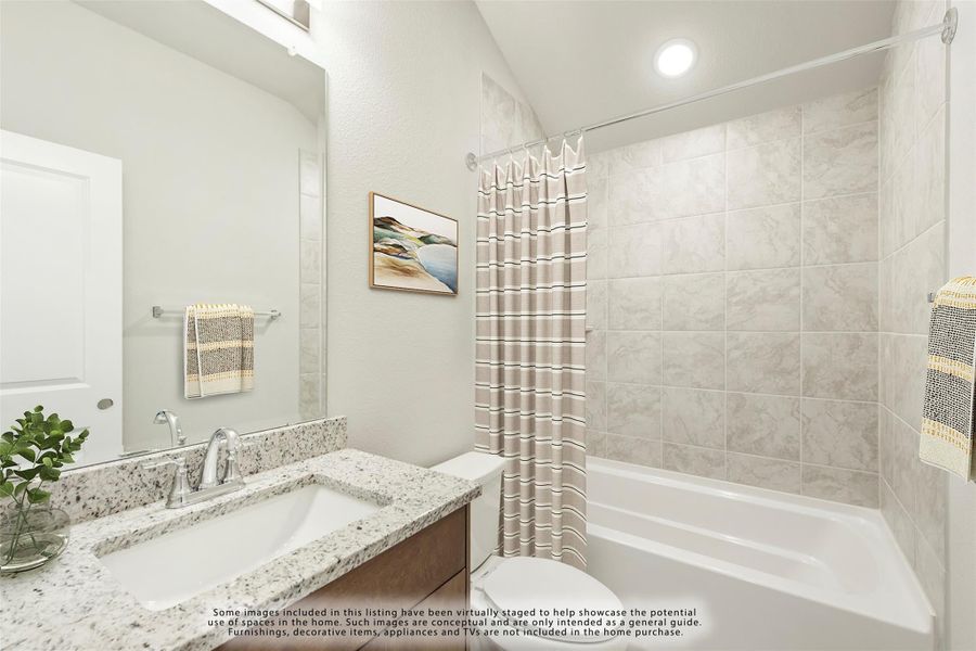 Bathroom with granite countertop vanity, tiled tub-shower combo, and striped curtain