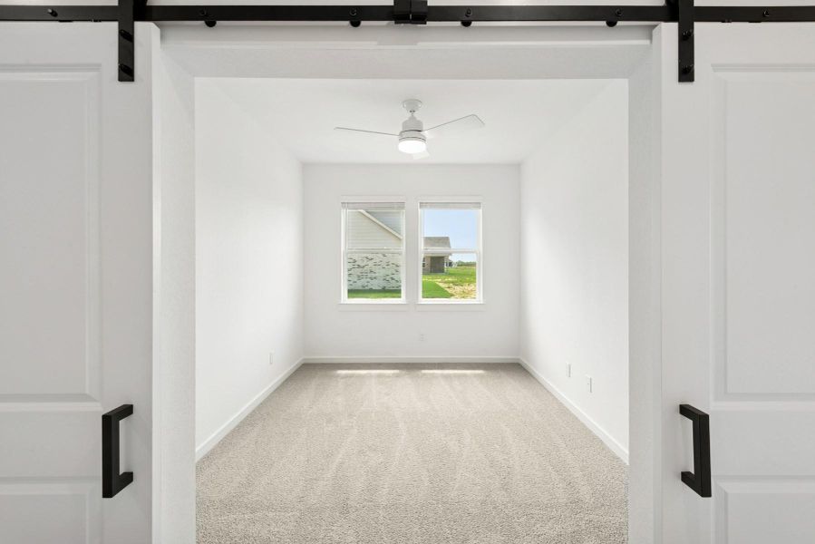 Private home office with barn doors Private home office with barn doors