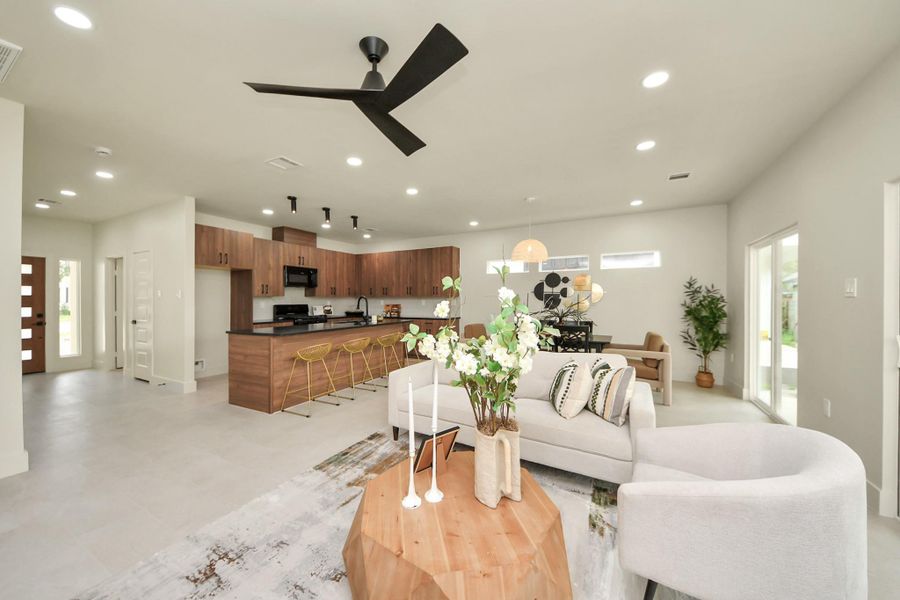 Expansive family room with designer tile flooring that is as durable as it is beautiful.
