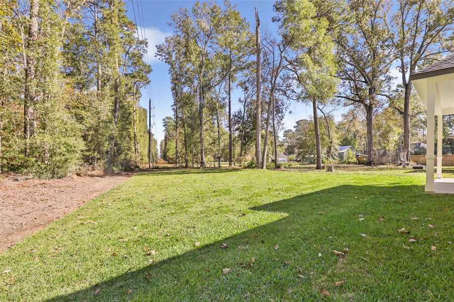 Exterior details and patio area of a home in , New Caney (Image 26).