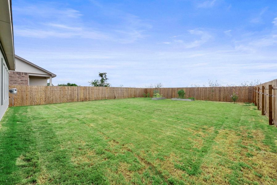 A spacious backyard awaits, fully fenced for privacy and outdoor enjoyment. A spacious backyard awaits, fully fenced for privacy and outdoor enjoyment.