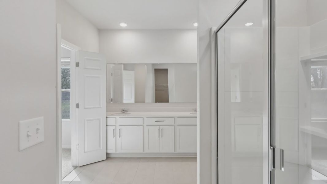 Luxury bathroom design emphasizing modern architecture in this elegant single-family home.