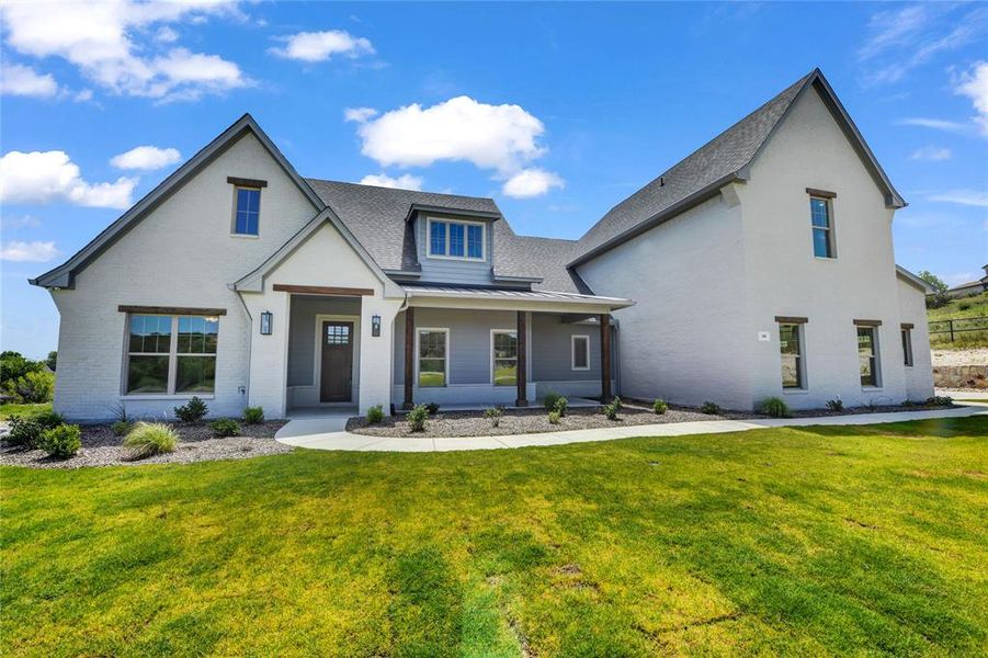 View of front of property featuring a front yard