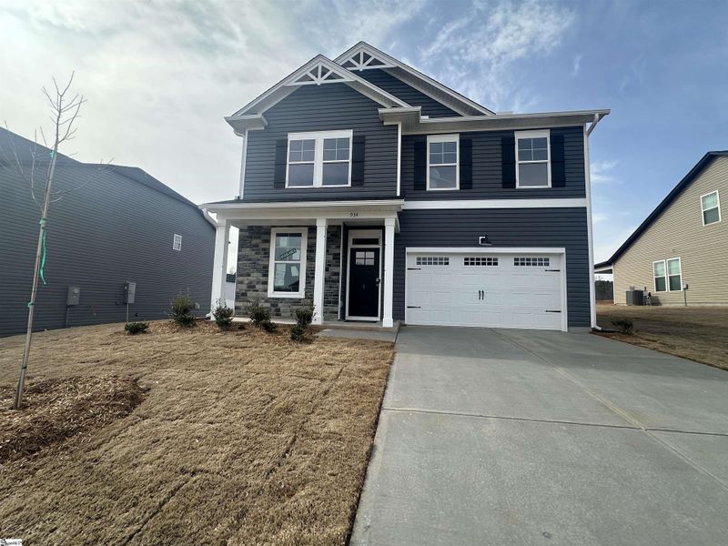 Front exterior of a new home in Shiloh Trail, Wellford, SC, highlighting curb appeal (Image 20). Front exterior of a new home in Shiloh Trail, Wellford, SC, highlighting curb appeal (Image 20).