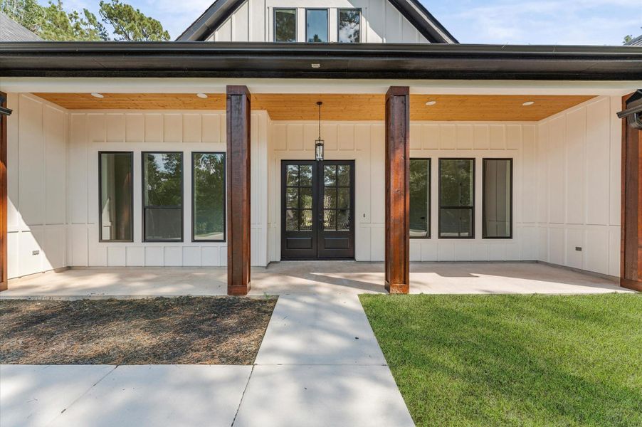 Covered front porch with wood-accent ceiling and LED lights. Covered front porch with wood-accent ceiling and LED lights.