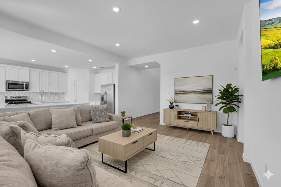 Main Living Area (Virtually Staged): Shown with virtual furnishings to illustrate scale and layout, this room comfortably supports a full seating arrangement while preserving open flow to the kitchen and dining areas. The staging helps buyers visualize how effortlessly the space comes together for everyday living and entertaining. Main Living Area (Virtually Staged): Shown with virtual furnishings to illustrate scale and layout, this room comfortably supports a full seating arrangement while preserving open flow to the kitchen and dining areas. The staging helps buyers visualize how effortlessly the space comes together for everyday living and entertaining.