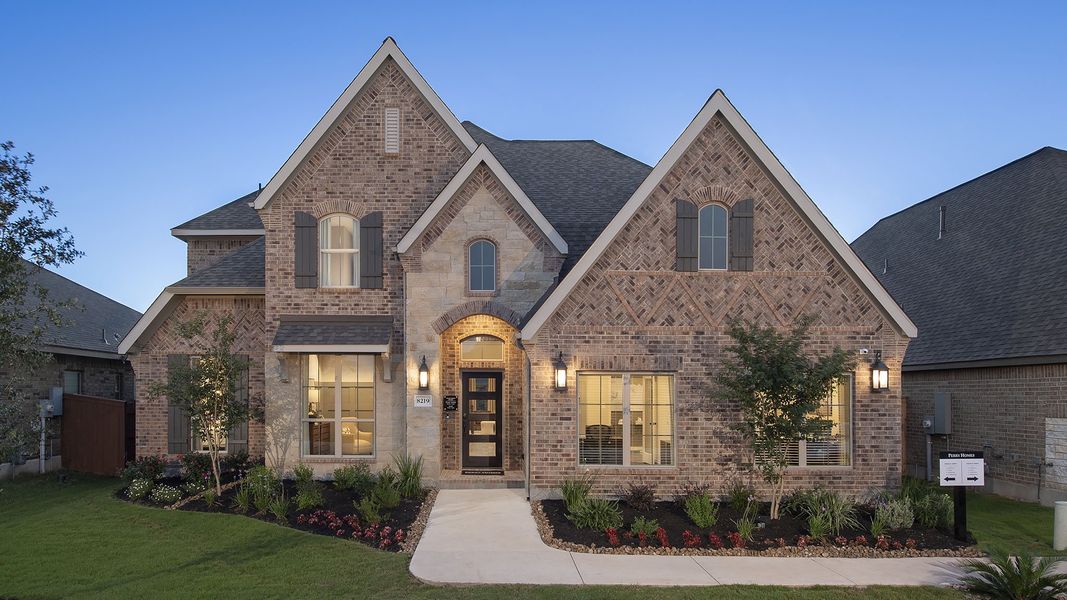 Front exterior of a new home in Santa Rita Ranch - Eldorado, Liberty Hill, TX, highlighting curb appeal (Image 2).