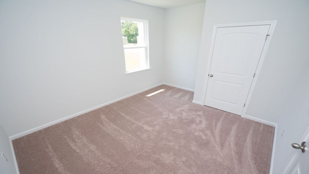 Representative unfurnished interior of a home built from the ROBIE by D.R. Horton in Indigo Preserve, Leland (Image 19).