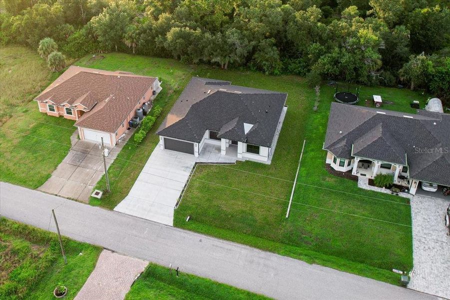Front exterior of a new home in , North Port, FL, highlighting curb appeal (Image 33). Front exterior of a new home in , North Port, FL, highlighting curb appeal (Image 33).