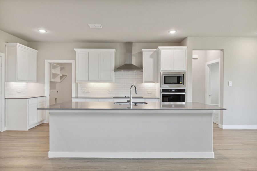 Kitchen in the Henley home plan by Trophy Signature Homes – REPRESENTATIVE PHOTO Kitchen in the Henley home plan by Trophy Signature Homes – REPRESENTATIVE PHOTO