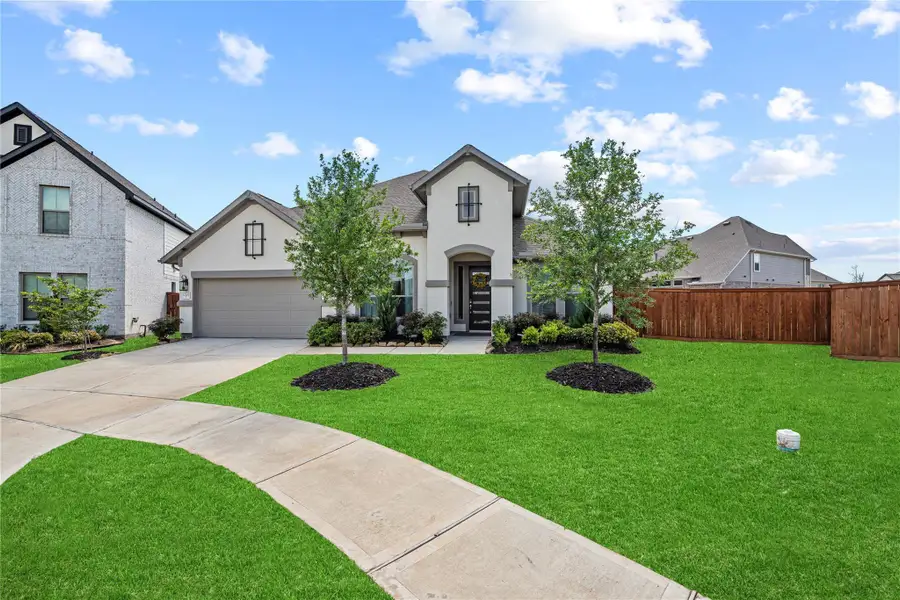 Front exterior of a new home in , Cypress, TX, highlighting curb appeal (Image 2).