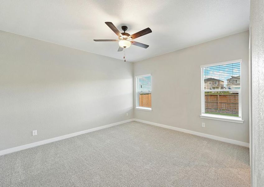 The two large windows in the master bedroom allow in great, natural light.