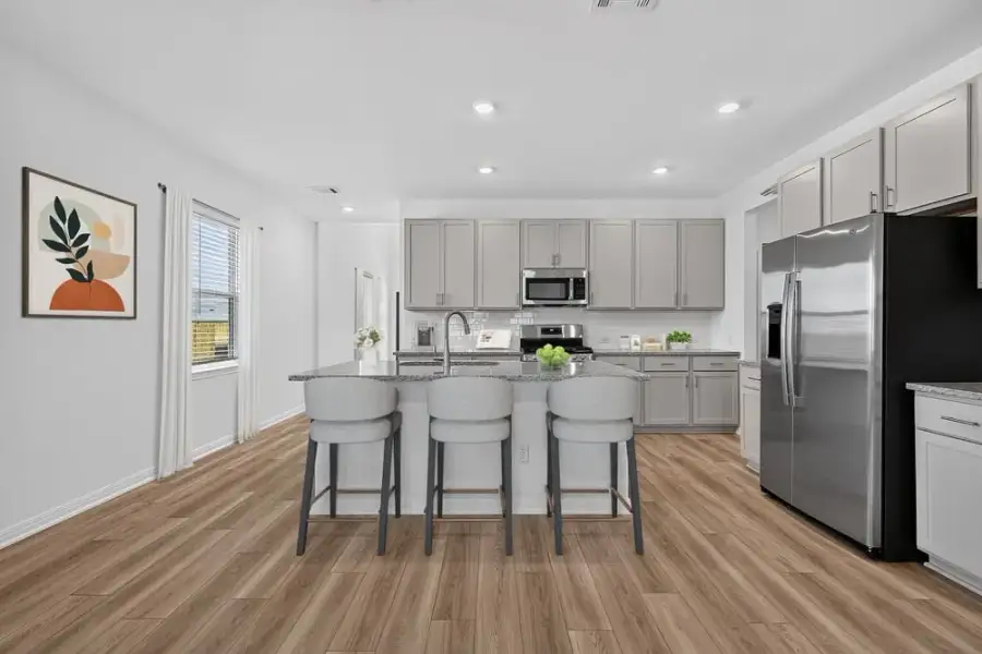 Representative furnished interior of a home built from the Merlin by Taylor Morrison in Sunfield, Mustang Ridge (Image 6).