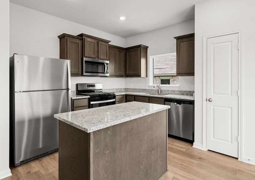 The kitchen has a convenient kitchen island. The kitchen has a convenient kitchen island.