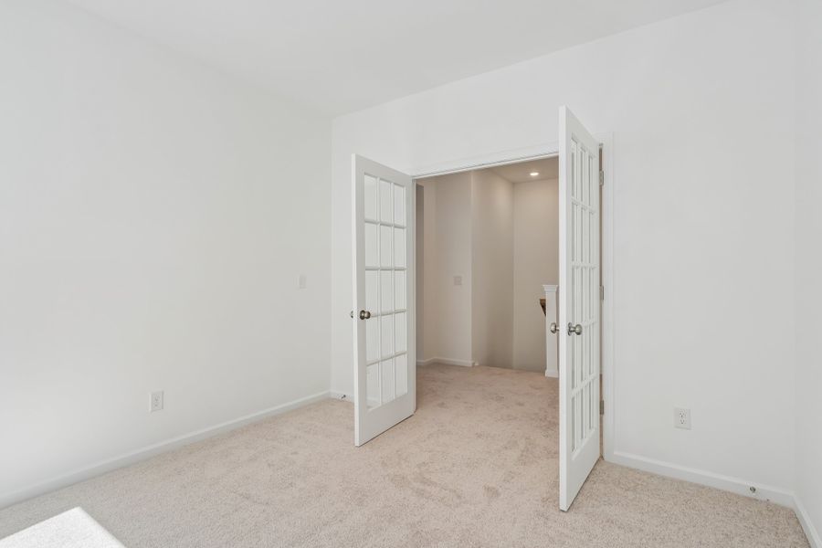 Spacious, unfurnished interior of a new home in Terraces at the Exchange, Indian Land (Image 19).