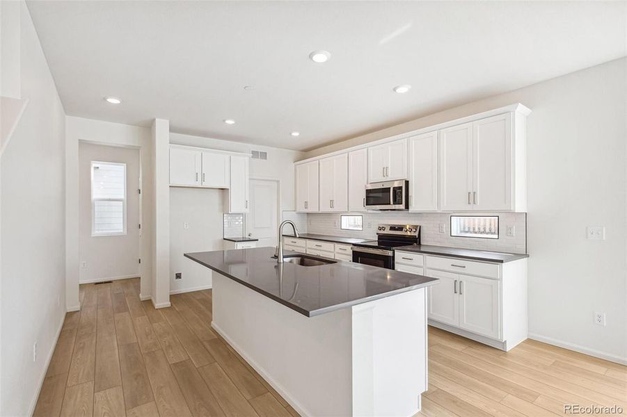 Furnished interior view inside a new home in Turnberry, Commerce City (Image 7).