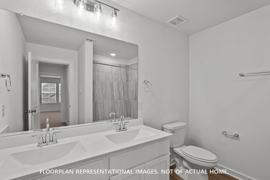 Furnished interior view inside a new home in The Oaks on 6th Street, Magnolia (Image 13).