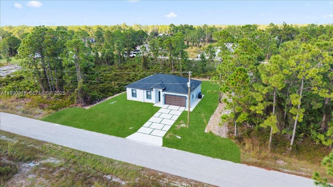 Front exterior of a new home in , Lehigh Acres, FL, highlighting curb appeal (Image 1). Front exterior of a new home in , Lehigh Acres, FL, highlighting curb appeal (Image 1).