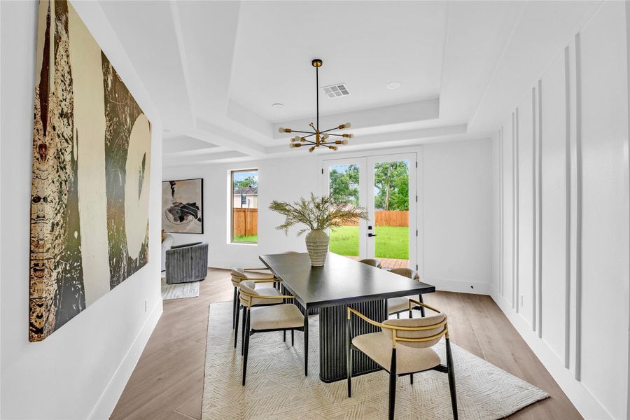 The spacious dining room could easily function as a playroom or study.