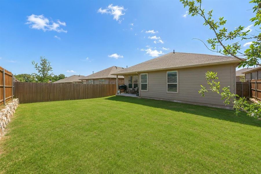 Exterior details and patio area of a home in Springhill South, Boyd (Image 20).