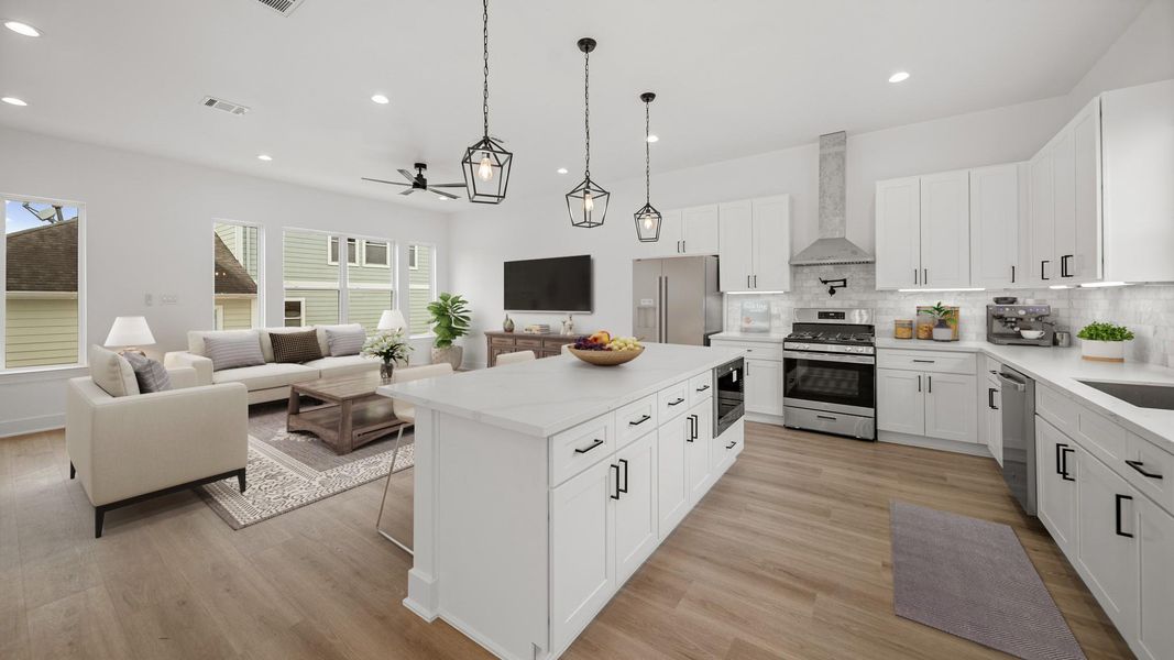 Virtually Staged: This photo highlights the open space - also featuring the flex space adjacant the kitchen. A great space for a dining room, home office, or bonus living space.