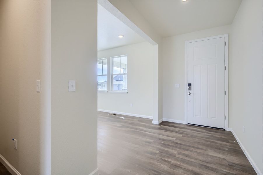 A room with a wood floor and white walls. A room with a wood floor and white walls.