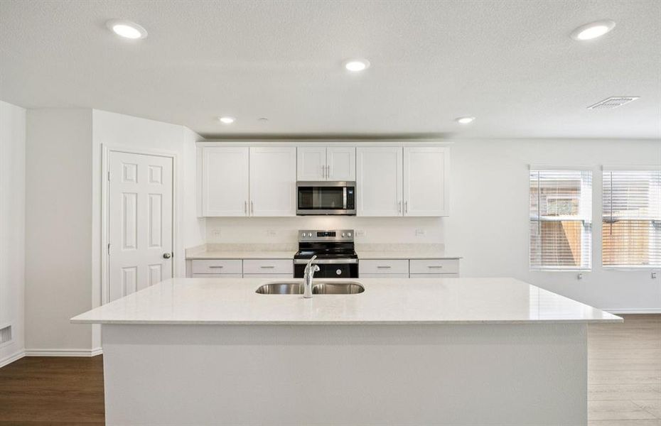 Kitchen featuring a large island ideal for informal dining and gatherings Kitchen featuring a large island ideal for informal dining and gatherings