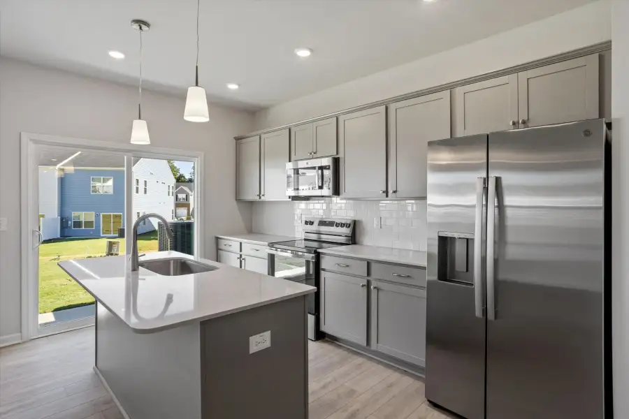 Furnished interior view inside a new home in West Main Townhomes, Sanford (Image 9).