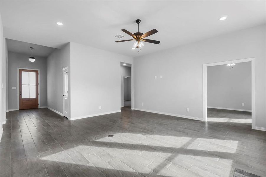 Empty room featuring ceiling fan and wood-type flooring