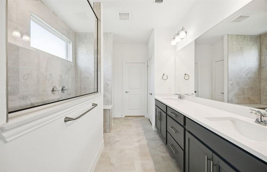 Owner's private bathroom with double vanity