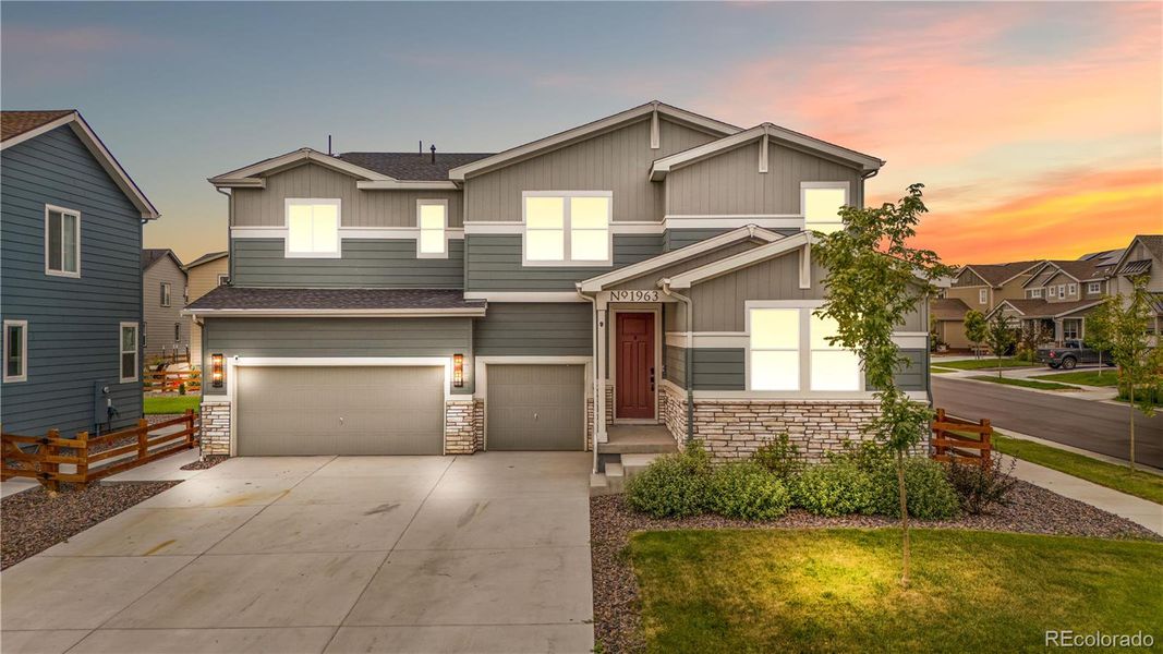 Front exterior of a new home in Morgan Hill, Erie, CO, highlighting curb appeal (Image 22).
