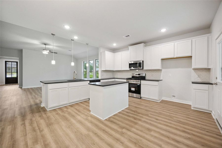 Furnished interior view inside a new home in Deer Pines, Conroe (Image 4).