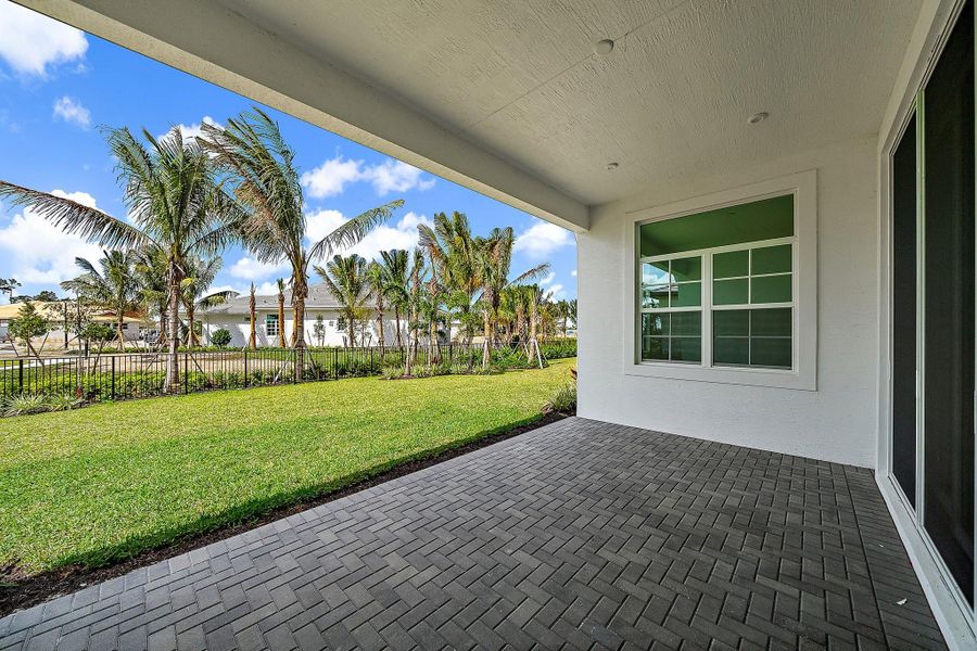 Exterior details and patio area of a home in L'Ambiance at Avenir, Palm Beach Gardens (Image 25).