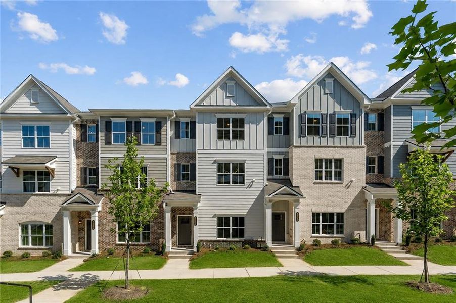 Front exterior of a new home in Townes at South Main, Kennesaw, GA, highlighting curb appeal (Image 1). Front exterior of a new home in Townes at South Main, Kennesaw, GA, highlighting curb appeal (Image 1).