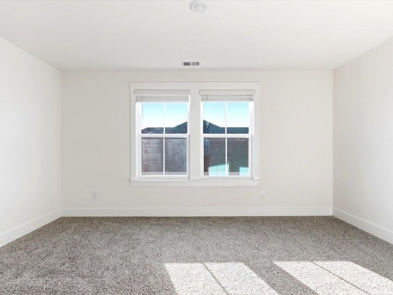Spacious, unfurnished interior of a new home in The Coves at Lakes of Cane Bay, Summerville (Image 30).