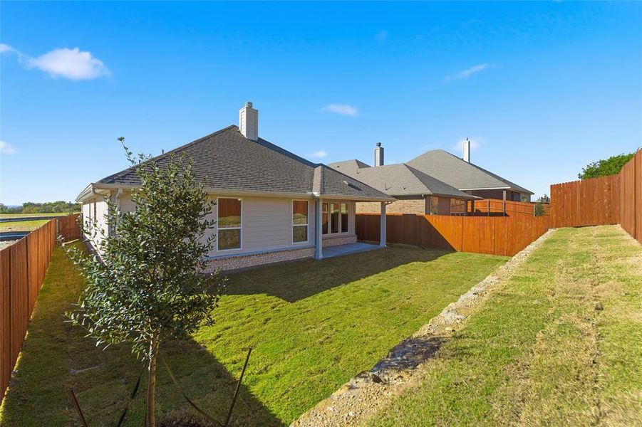 Exterior details and patio area of a home in Waterford Park, Weatherford (Image 24).