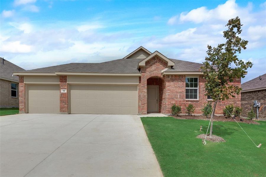 Ranch-style home with a front lawn and a garage