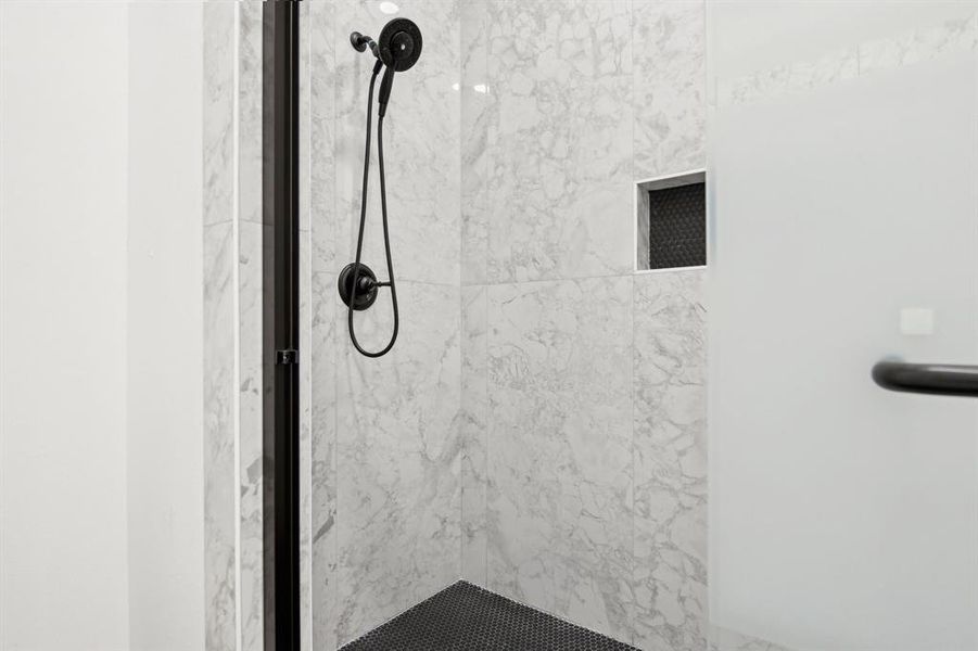 Room details featuring a shower stall