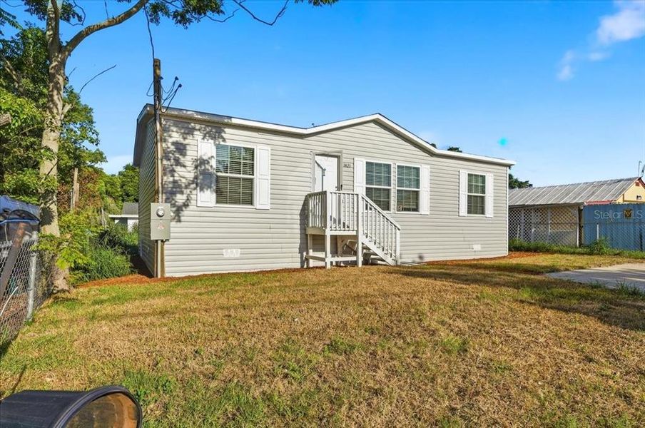 Exterior details and patio area of a home in , Port Richey (Image 21).