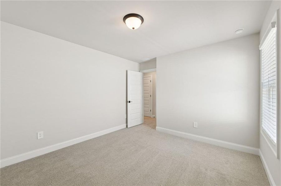Spacious, unfurnished interior of a new home in Vines at Mill Creek - Estate Series, Braselton (Image 42).
