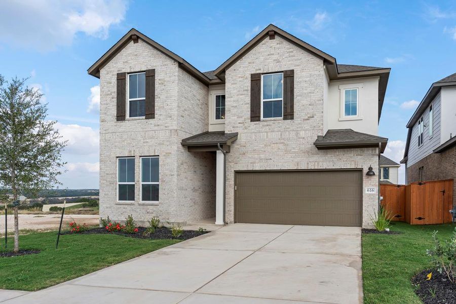 Front exterior of a new home in Lariat, Liberty Hill, TX, highlighting curb appeal (Image 2). Front exterior of a new home in Lariat, Liberty Hill, TX, highlighting curb appeal (Image 2).