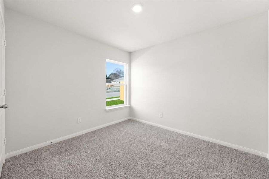 Unfurnished room with carpet flooring