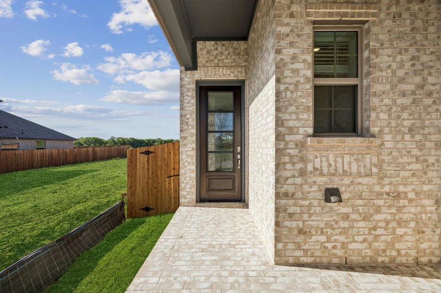 Front exterior of a new home in Avondale, Fate, TX, highlighting curb appeal (Image 9). Front exterior of a new home in Avondale, Fate, TX, highlighting curb appeal (Image 9).