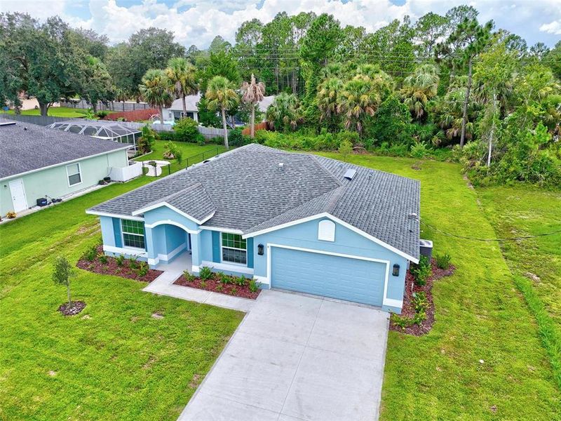 Front exterior of a new home in , Palm Coast, FL, highlighting curb appeal (Image 41).