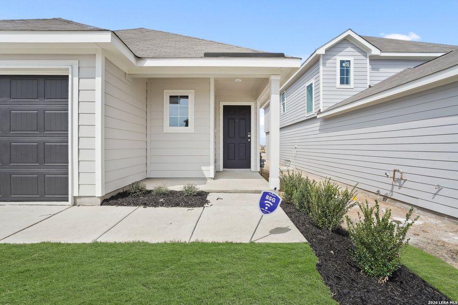 Exterior details and patio area of a home in Hickory Ridge, Elmendorf (Image 4).