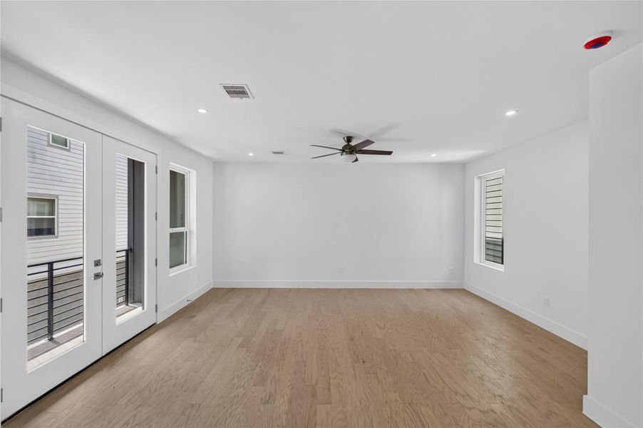Open living room area with plenty of natural light and a sliding door to the porch.