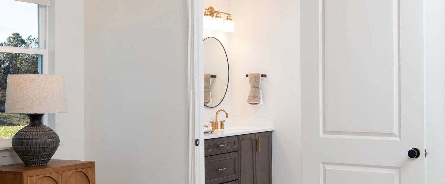 Furnished interior in a model home at Oakfield Trails Traditional in Parrish (Image 16).