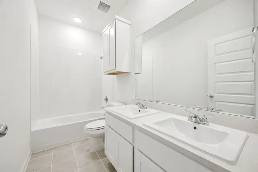 Bathroom in the Spruce home plan by Trophy Signature Homes - REPRESENTATIVE PHOTO
