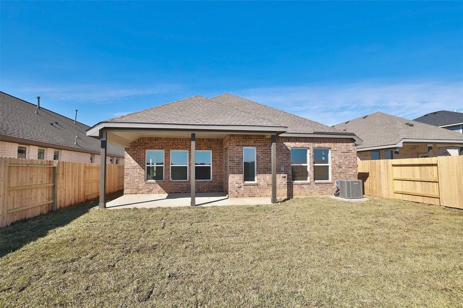 Front exterior of a new home in Cypress Green, Hockley, TX, highlighting curb appeal (Image 17).