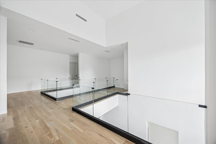 Two secondary bedrooms are located on this level, each with an en-suite bath.